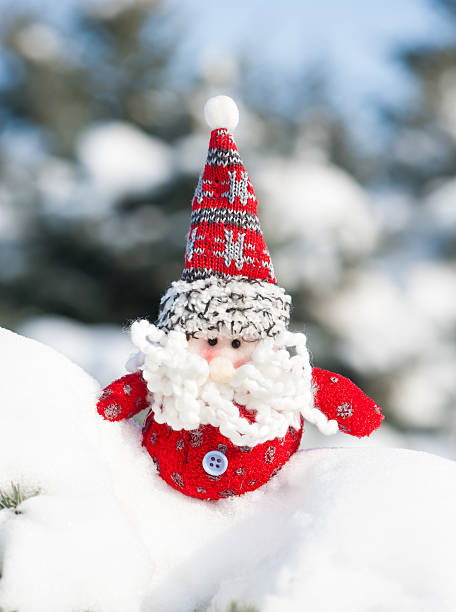 istock santa toy in snowdrift with snow 471959243