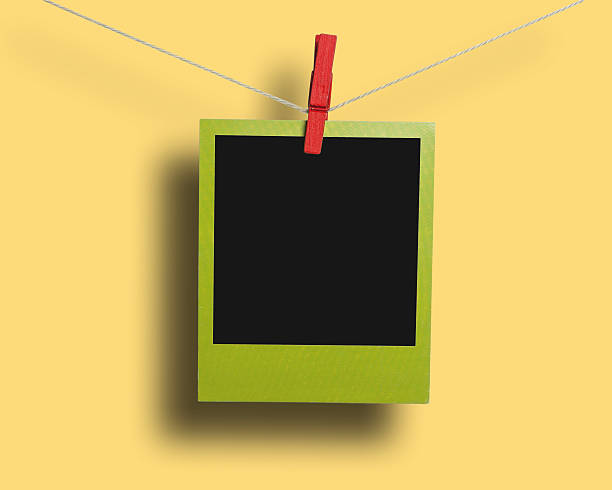 istock Green photo frame on a clothesline 471959966