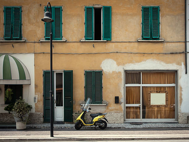 istock Scooter in front of a shop 471960191