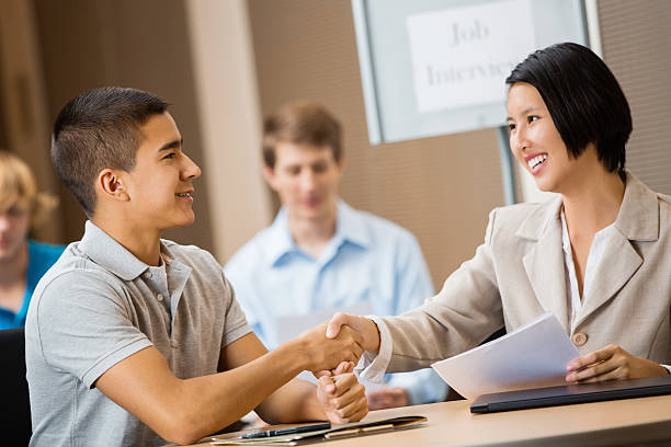 istock College advisor meeting with high school students at career fair 471961377