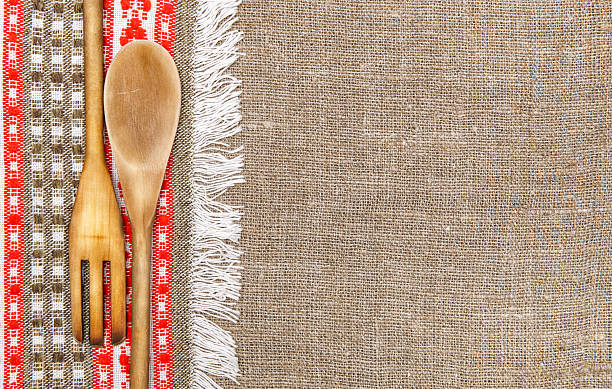 istock Burlap background bordered by country cloth and utensils 471963357