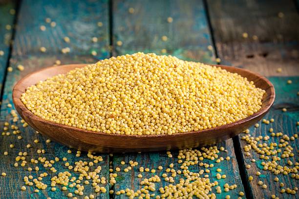 istock organic millet seeds in a wooden bowl 471963376