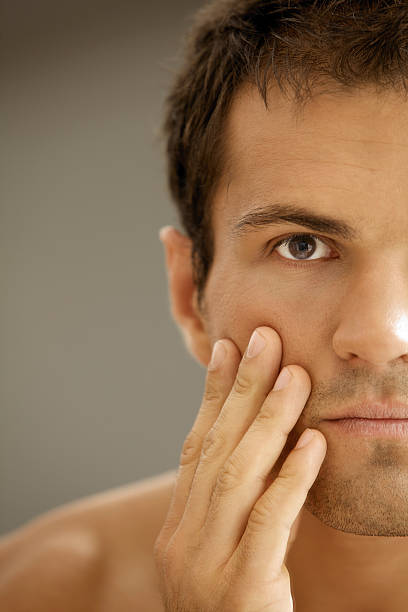 istock Close-up of young man applying shaving cream 471964582