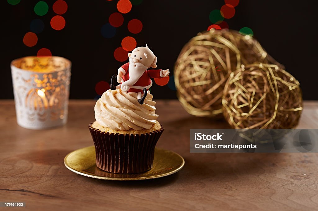 Santa Claus cupcake on Christmas background Santa Claus cupcake on black Christmas background Backgrounds Stock Photo