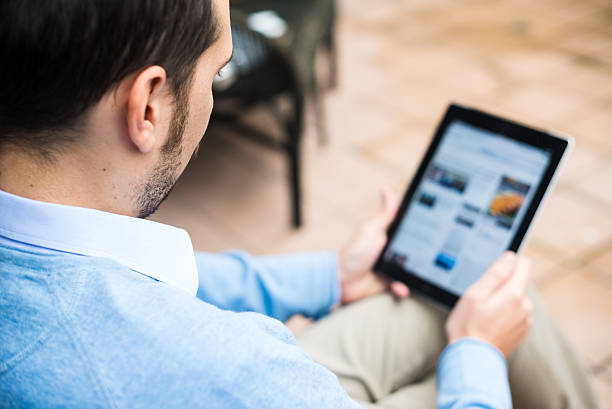istock elegant business multitasking multimedia man at home 471965197