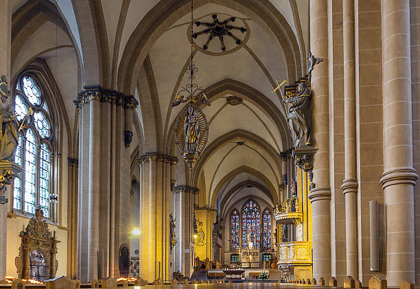 Paderborn Cathedral, Germany Catholic Paderborn Cathedral  is mainly of the 13th century. Interior, service with the cathedral choir paderborn stock pictures, royalty-free photos & images