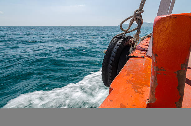 istock Fishing boats sailing on rough sea 471966871