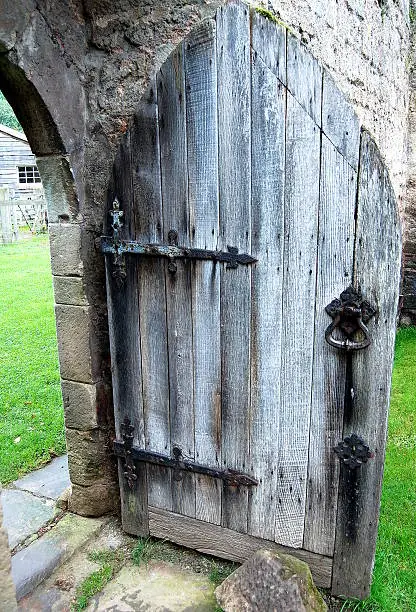 The Old Oak door still standing in the ruins of the Norman Chapel at Lower Brockhampton