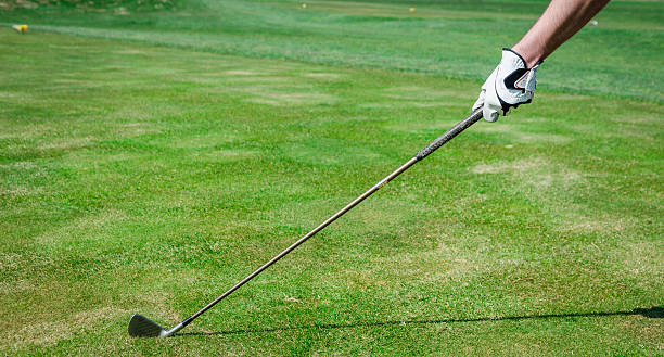istock Hand is holding a golf club and measuring the Trajectory. 471968742