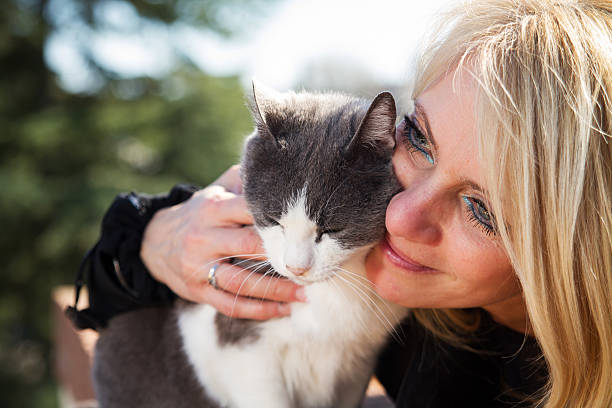 istock Girl with her cat outdoor 471968880