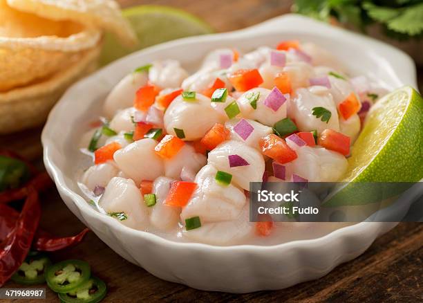 A White Dish Of Ceviche Garnished With A Slice Of Lime Stock Photo - Download Image Now