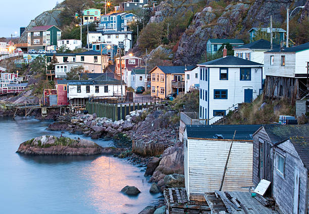 Old Fishing Village at Night A quaint fishing village in Newfoundland, Canada. Queen's Battery, St. John's st. johns newfoundland photos stock pictures, royalty-free photos & images