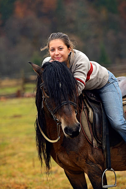 istock Girl with Horse 471973325