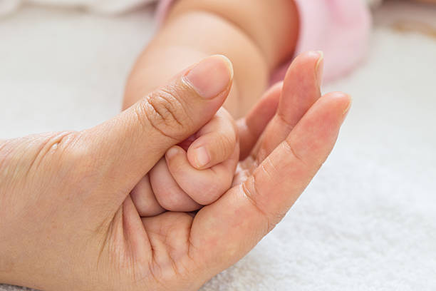 istock New born baby hand 471973656