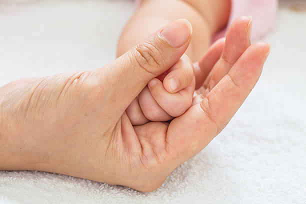 istock New born baby hand 471973660