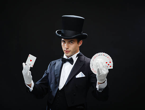 istock magician showing trick with playing cards 471974559