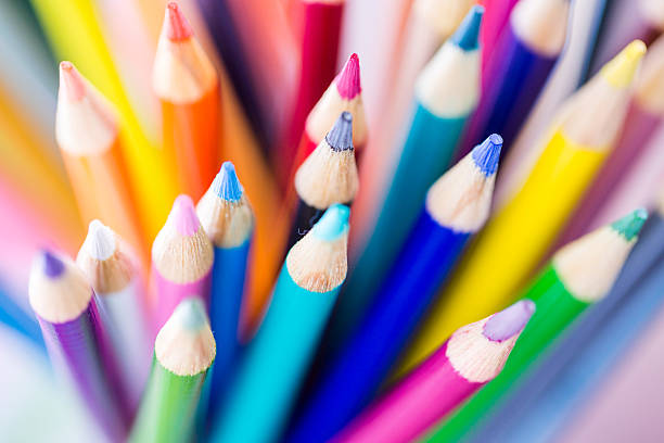 Downward view of a Variety of sharpened colored pencils New school supplies ready for new school year. colored pencil stock pictures, royalty-free photos & images