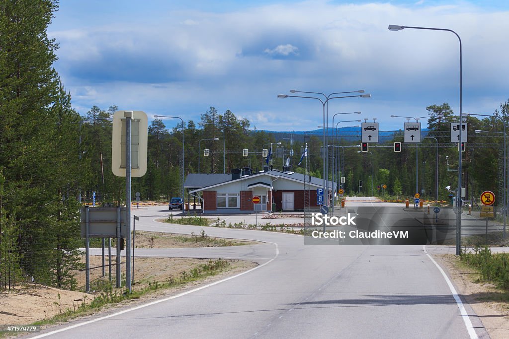 Raja-Joosepin Russian Border Crossing in Lapland, Finland. Raja-Joosepin Russian Border Crossing in Lapland, Finland. View from Lapland into Russia. No traffic under blue cloudy skies. Hidden in a forest. Finland Stock Photo