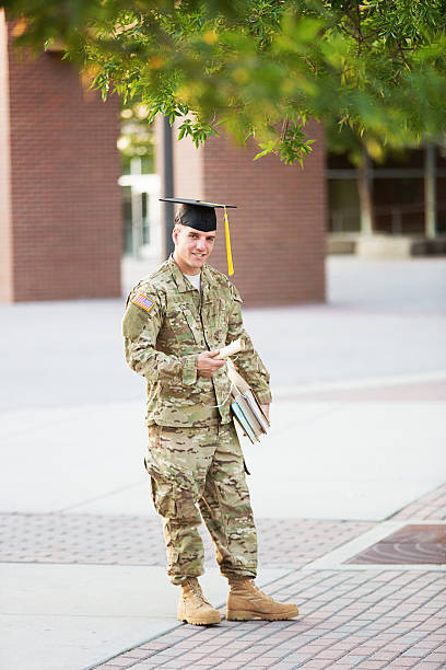 istock American Soldier with graduation hat 471975025