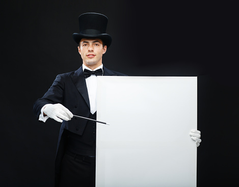 performance, circus, show, advertisement concept - magician in top hat with magic wand and white board showing trick