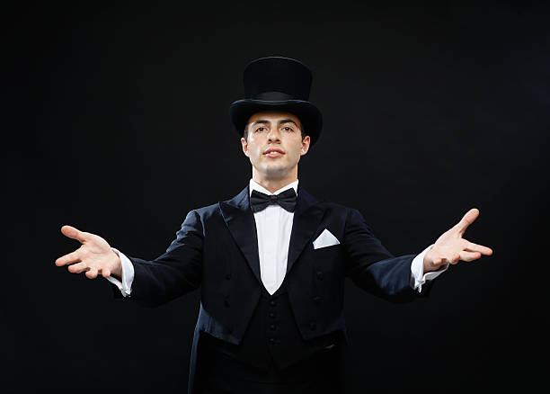 istock magician in top hat showing trick 471975565