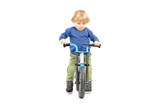 istock Cute male kid riding his bicycle 471975717