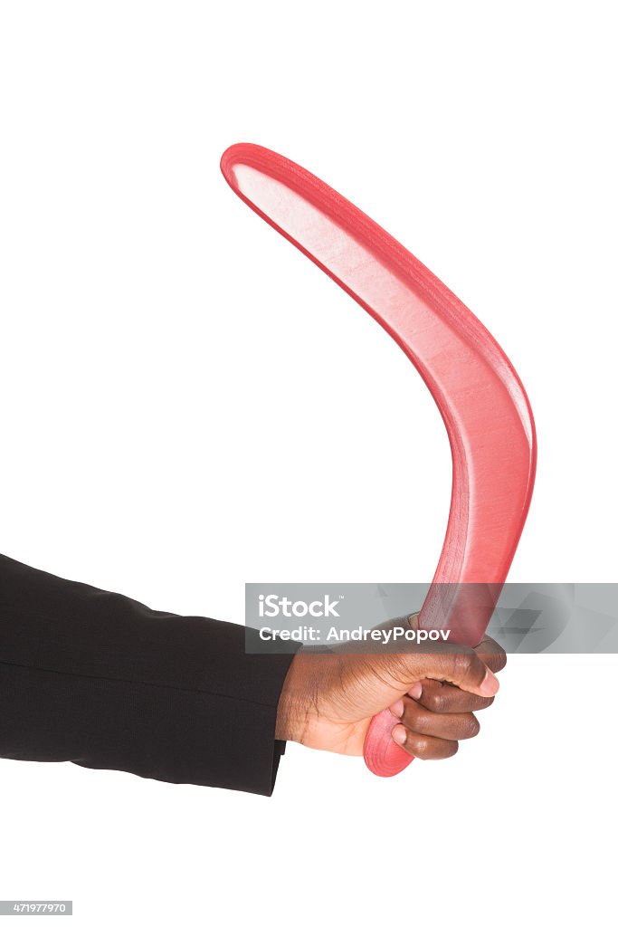 Maschio donna mano Holding Boomerang - Foto stock royalty-free di Boomerang