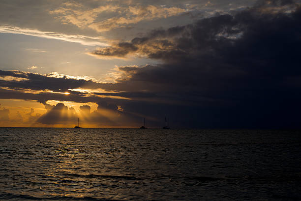 Sailing boats in sunrise stock photo