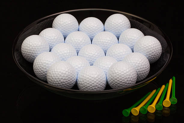 istock Black ceramic bowl full of golf balls 471978336