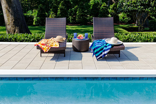 Poolside Setting with Refreshments and Lounging stock photo