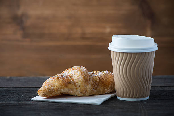 istock Take away coffee and fresh croissant 471979320