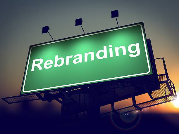 Rebranding - Billboard on the Sunrise Background. Rebranding - Green Billboard on the Rising Sun Background. motto stock pictures, royalty-free photos & images