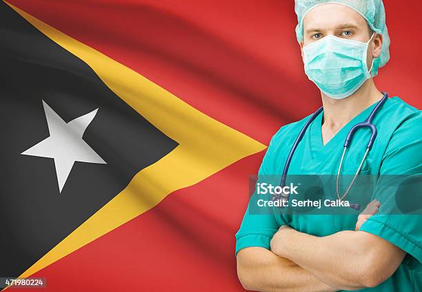 Surgeon With National Flag On Background Series East Timor Stock Photo - Download Image Now