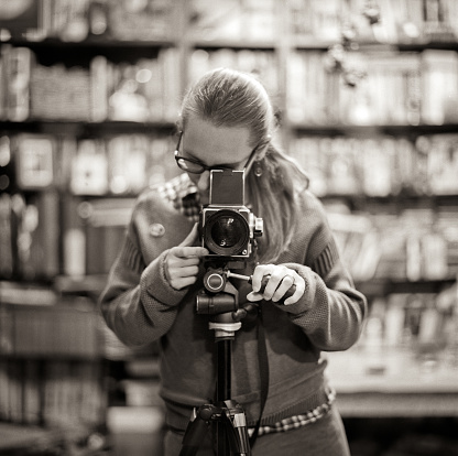 Young woman taking self-portrait.