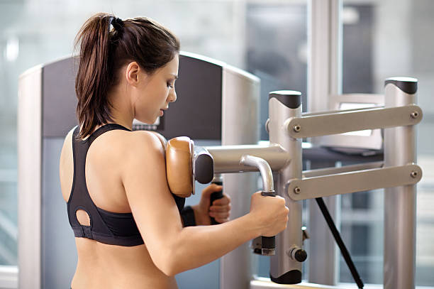 istock Young female working out at a gym 471984952