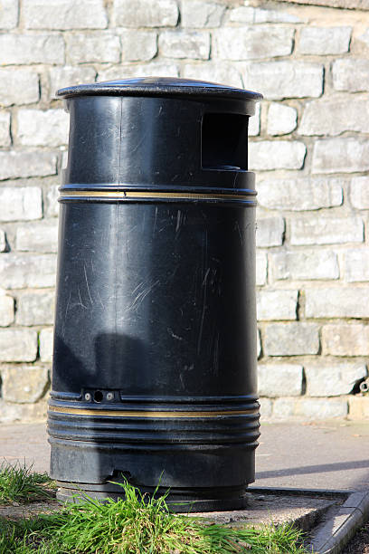 istock Image of single outdoor litter bin, made from black metal 471985452