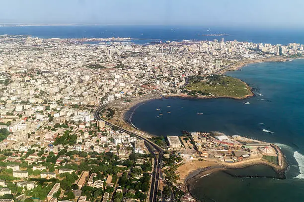 Aerial view of the city of Dakar, Senegal, showing the densely packed buildings and a highway