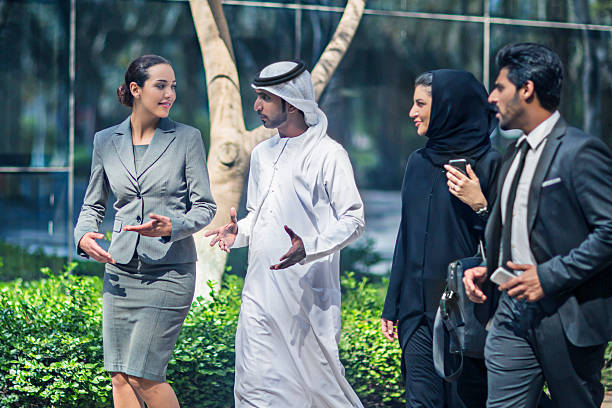 istock Middle Eastern business people talking in the street 471986384