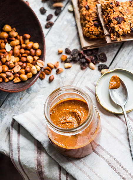 istock Fresh peanut butter in the pot and tea spoon 471986490