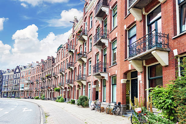 istock Amsterdam and typical houses with clear summer sky.Netherlands 471987033