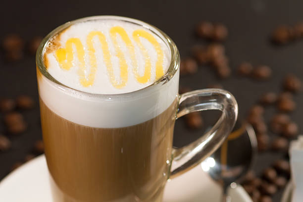 istock cup of coffee and coffee beans over dark background 471987094