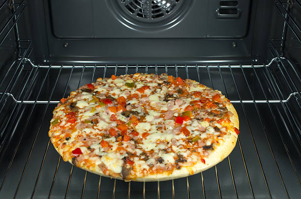 istock Freshly baked hot pizza in the oven. 471988097
