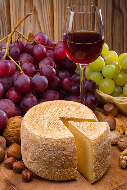 istock glass of wine, cheese and grapes 471989427
