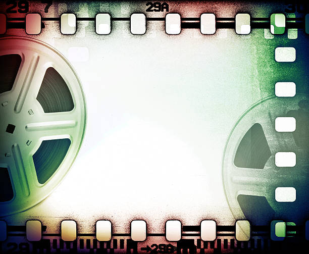 istock Old motion picture reels with film strip. 471990357