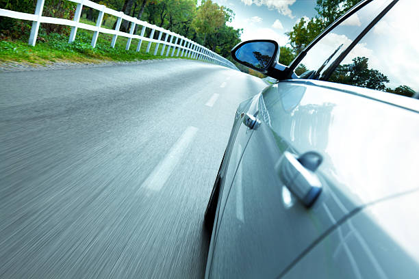 istock driving car on country road 471990673