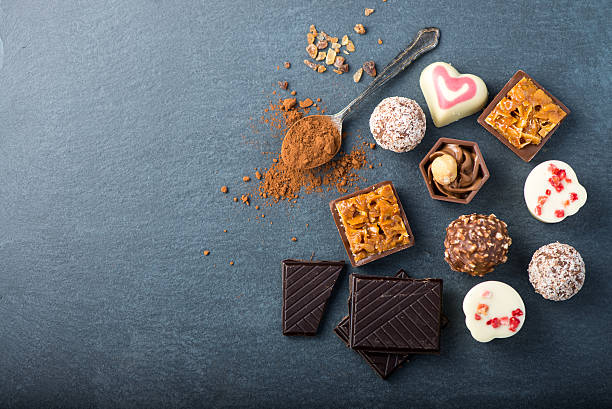 istock selection of artisan chocolates praline on black background 471990928