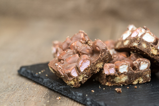 Rocky road squares on rustic background