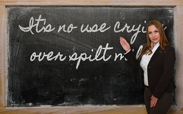 istock Teacher showing It s no use crying over spilt milk 471991435