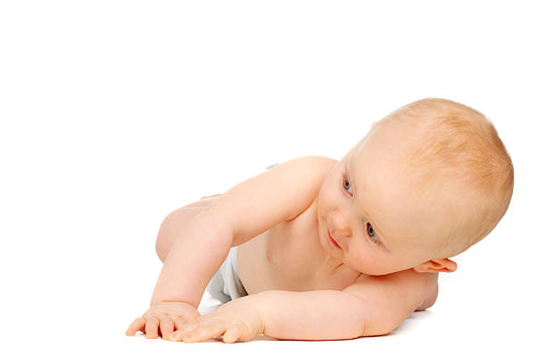 istock Baby laid on his front isolated white background 471992927