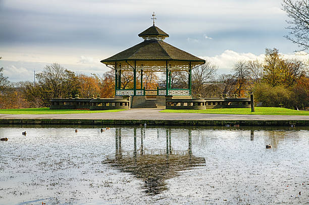 Bandstand and pond in Huddersfield, England stock photo